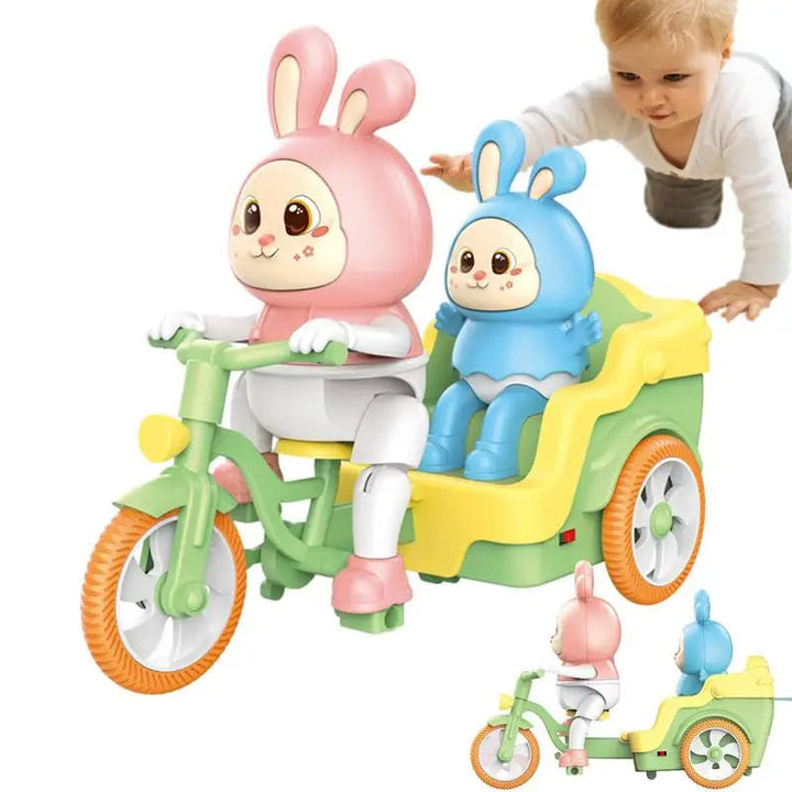 Pink and blue rabbits on a green and yellow toy tricycle, shown beside a crawling child.