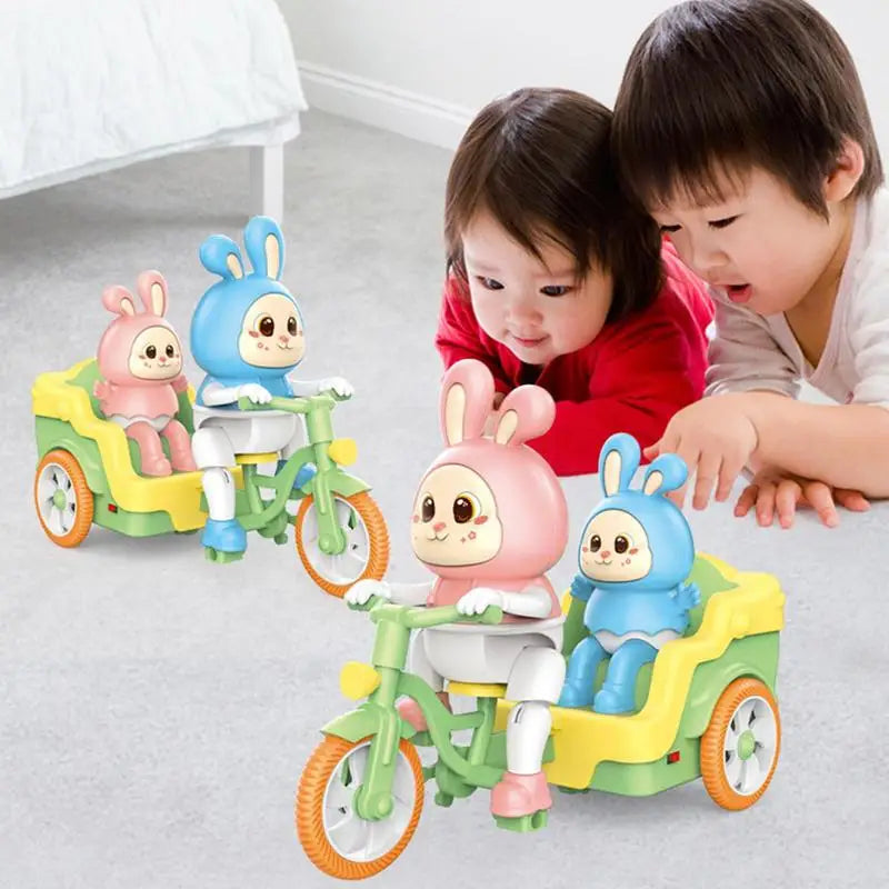 An adult and child watch colorful rabbit toy tricycles on the floor.