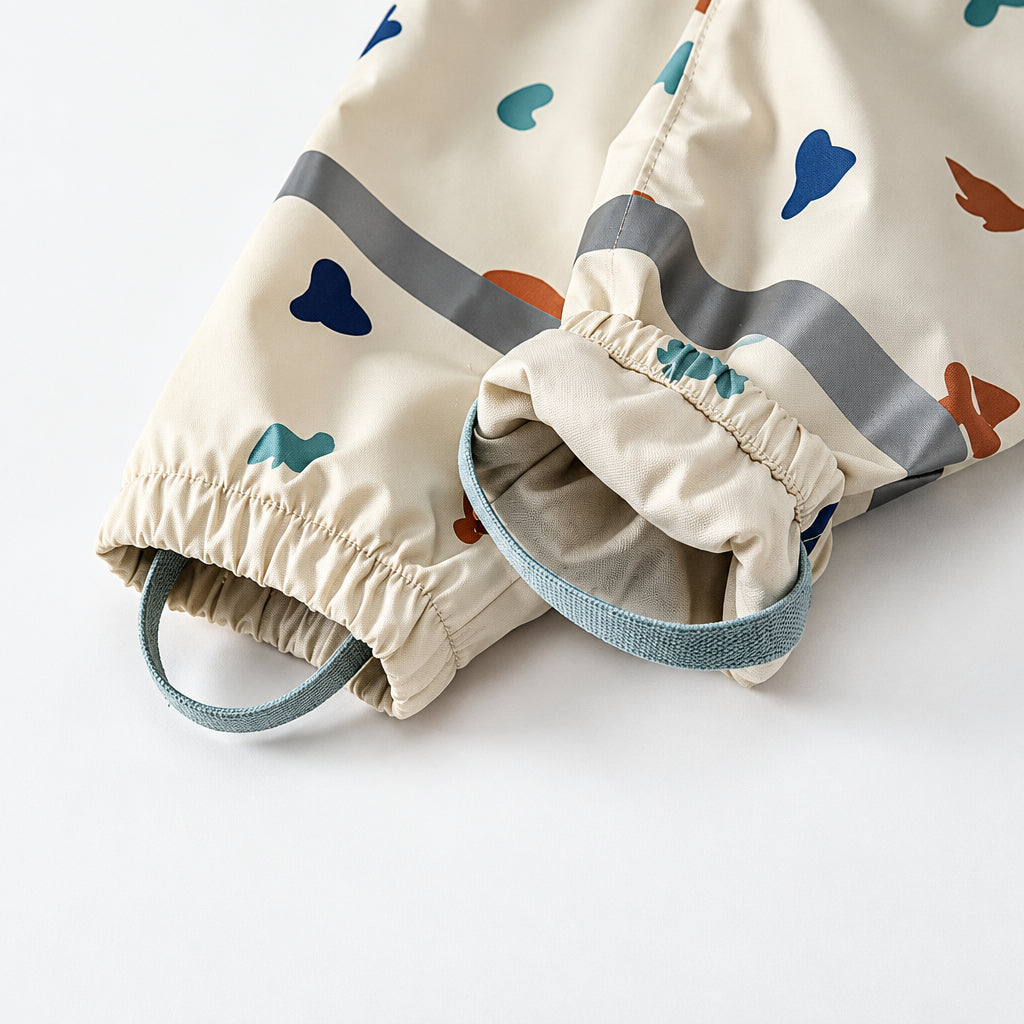 Rain pants with elastic ankle cuffs, gray bands and teal foot loops.