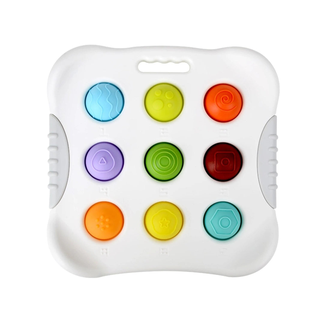 White sensory toy with nine colorful buttons and a top carry opening
