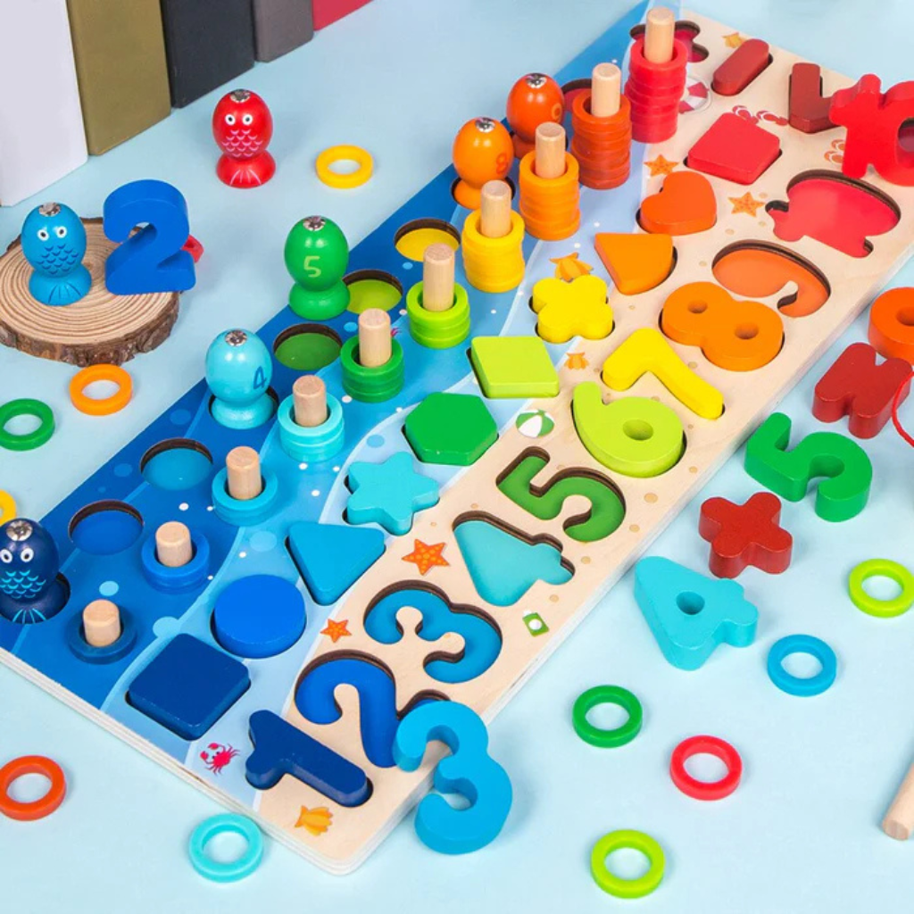 Close-up of a colorful wooden counting board with numbered pieces, shapes, fish, and stacked rings