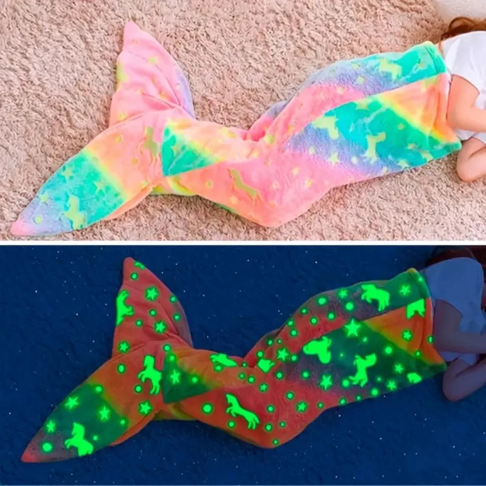 Rainbow mermaid sleeping bag in daylight and darkness, showing its glowing star and unicorn pattern.
