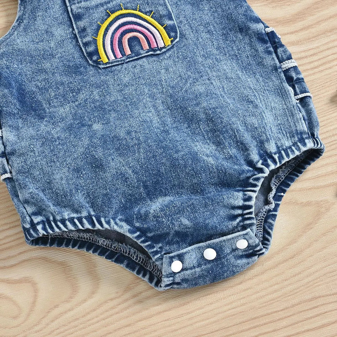 Rainbow front pocket, elasticized leg openings and bottom snaps on the denim romper