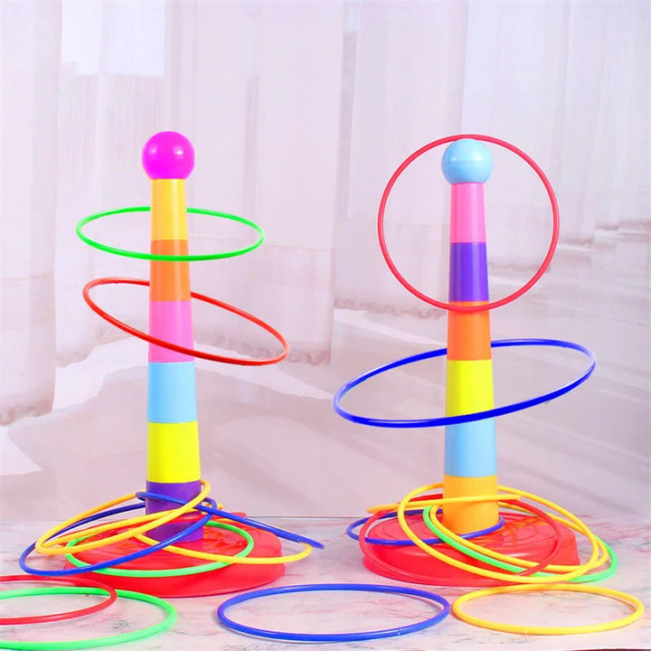 Two colorful ring toss towers on red bases with multicolored rings around them