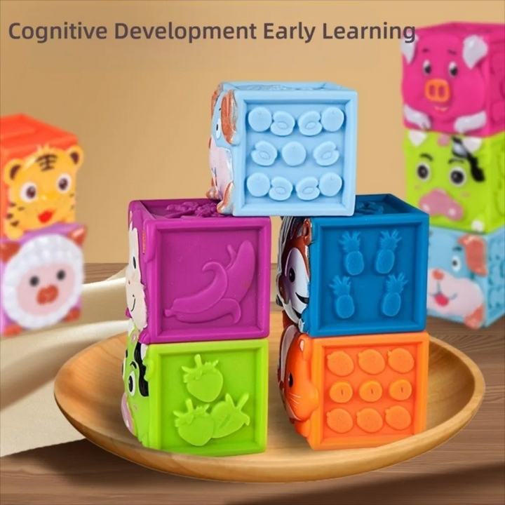 Animal blocks showing raised dots, numbers and animal patterns on their sides