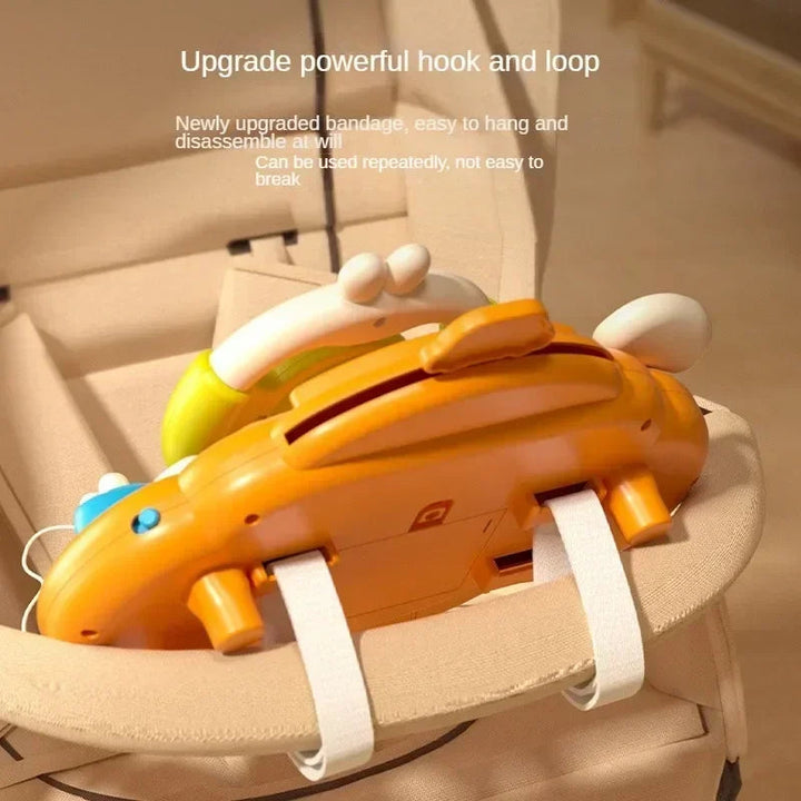 Rear view of the toy steering wheel attached to a stroller bar with hook-and-loop straps