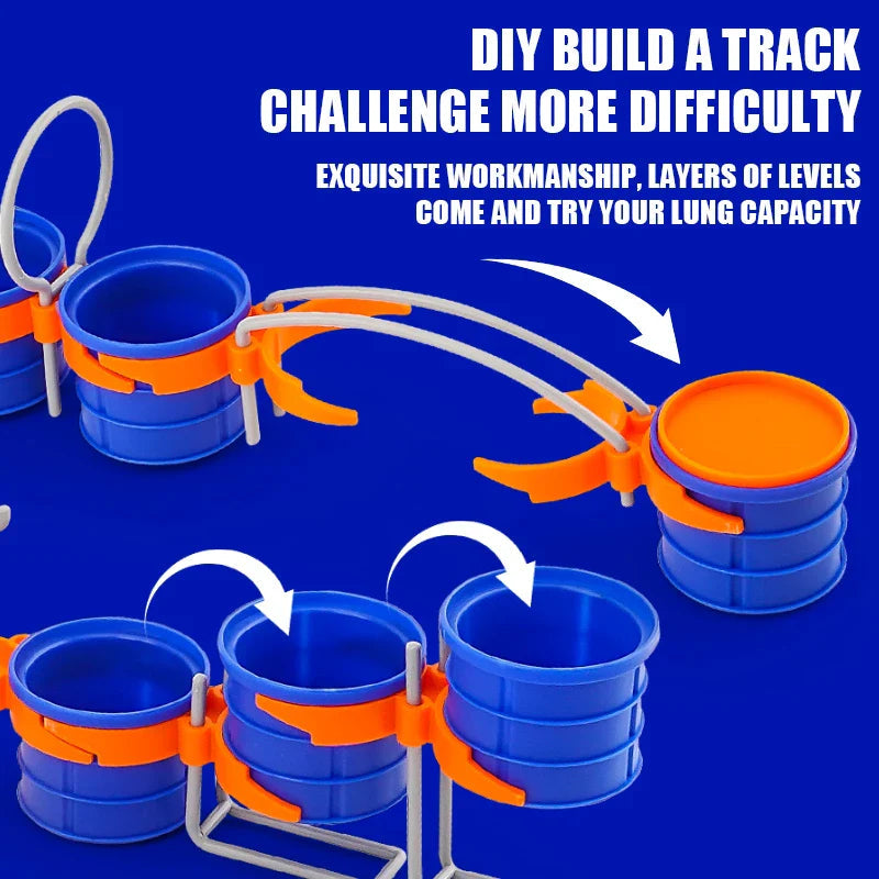 Blue cups with orange connectors and gray track pieces arranged in two different course layouts