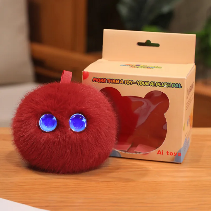 Red AI plush toy with blue eyes displayed beside its retail box