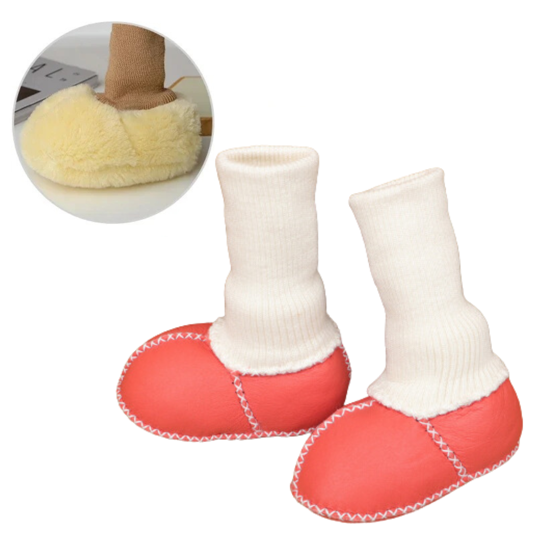 Red baby slippers with tall white knit cuffs and contrast stitching