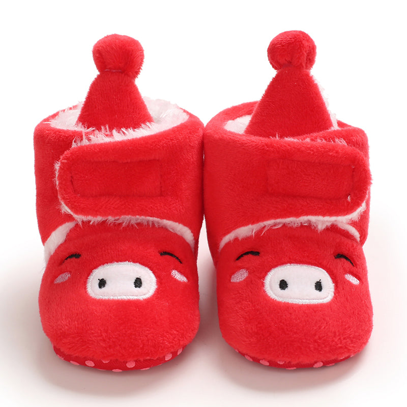 Red baby slippers with embroidered animal faces and tall red pom-pom hats