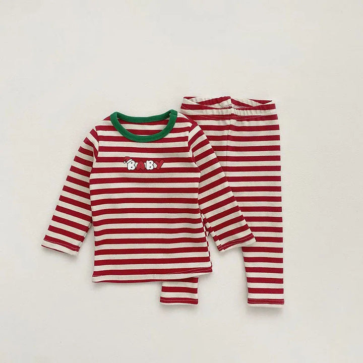 Red-and-white striped long-sleeve baby pajama top and pants with green neckline trim