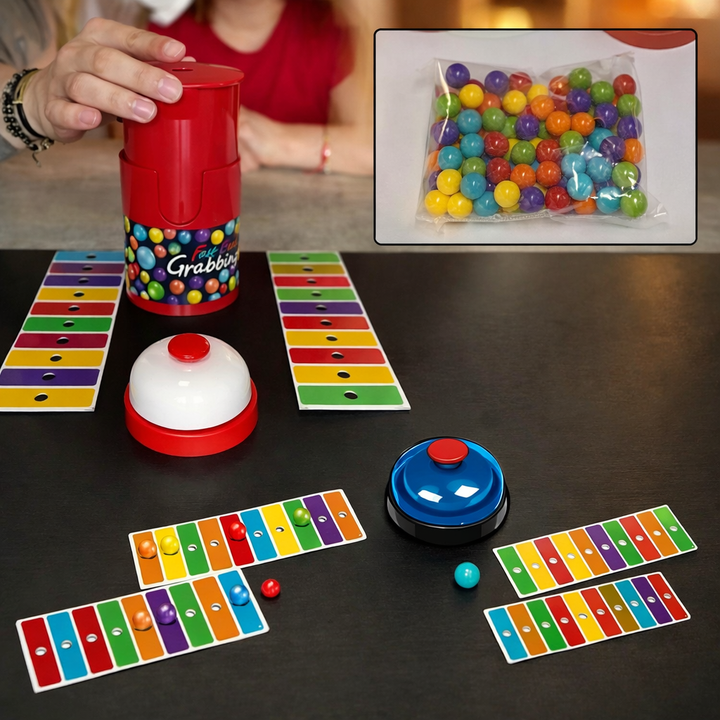 Color-matching setup with a red bead dispenser, colored cards, loose beads, and two bells