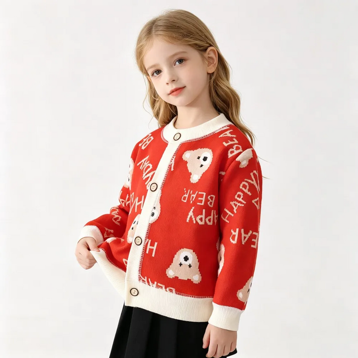 Child wearing a red bear-pattern cardigan with cream neckline, cuffs, and button placket
