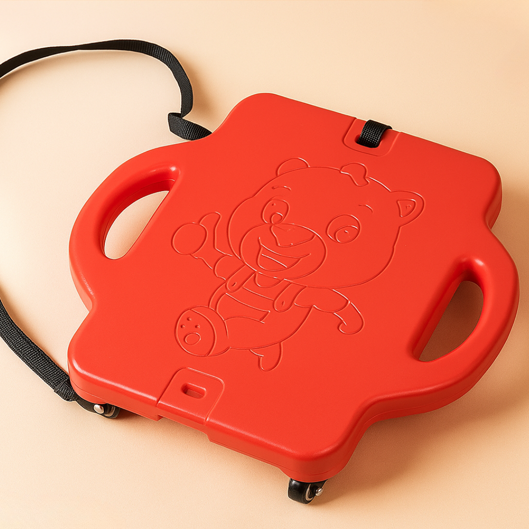 Red scooter board with side handles, a bear design, caster wheels, and an attached black pull rope