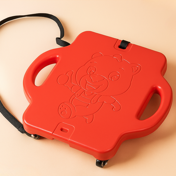 Red scooter board with side handles, a bear design, caster wheels, and an attached black pull rope