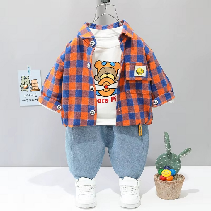 Red-and-blue checkered jacket over a bear-print T-shirt with light blue pants