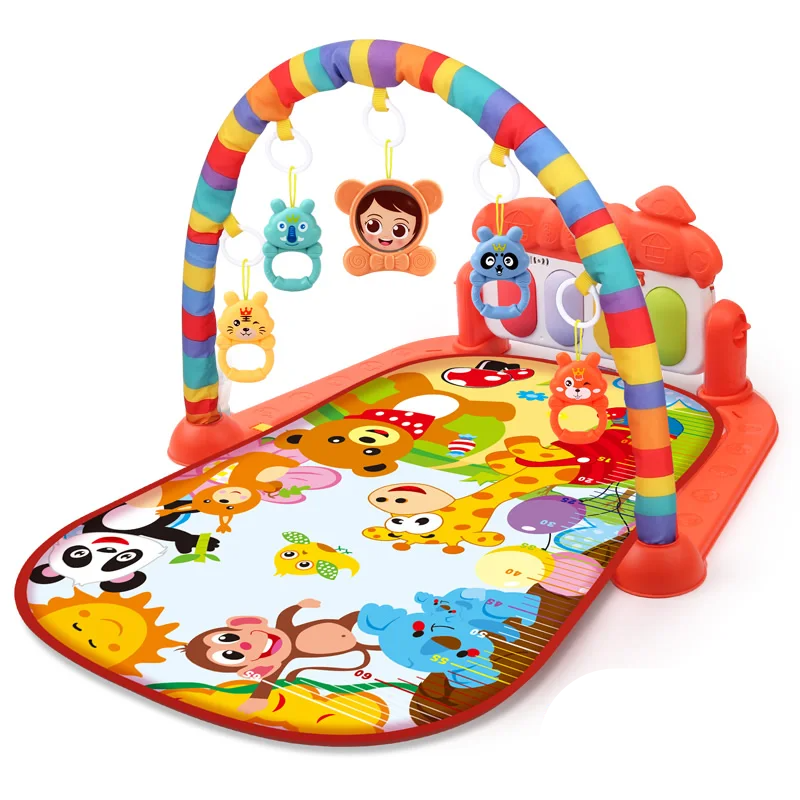 Red baby gym with a bright animal-print mat and rainbow-striped arch