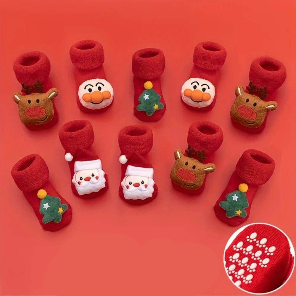 Red baby socks with deer, tree, clown and Santa details, plus an inset showing dotted soles