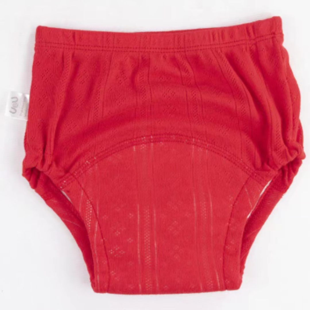 Red cotton training pants with a curved absorbent panel and gathered leg openings.