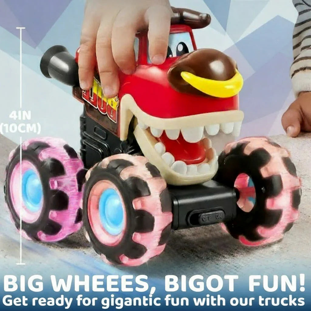 Hand resting on a red dinosaur monster truck with pink-lit tires and blue wheel centers