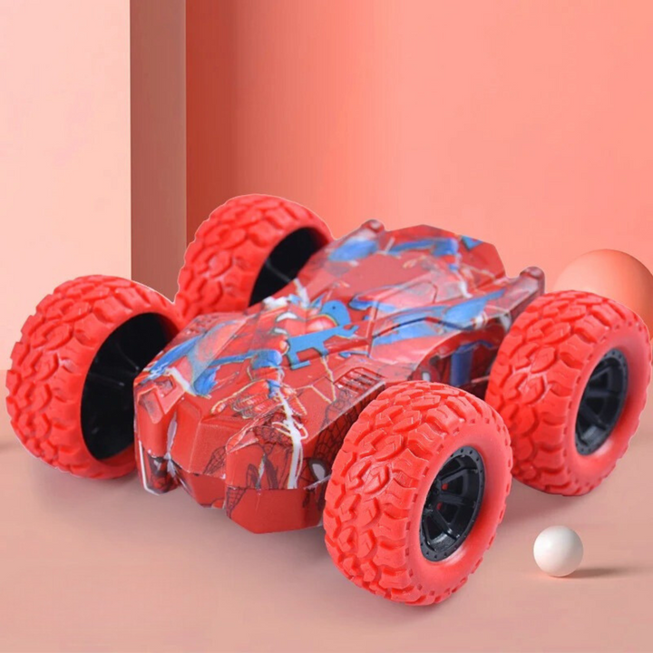 Red toy car with textured red wheels and blue body graphics on a red background.