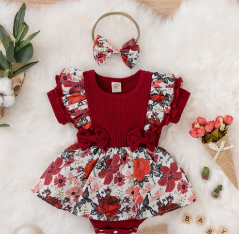 Red baby romper with floral ruffle sleeves, waist bows and a matching bow headband