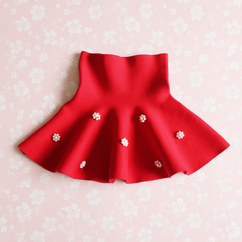 Red A-line knit skirt with flower-shaped bead accents