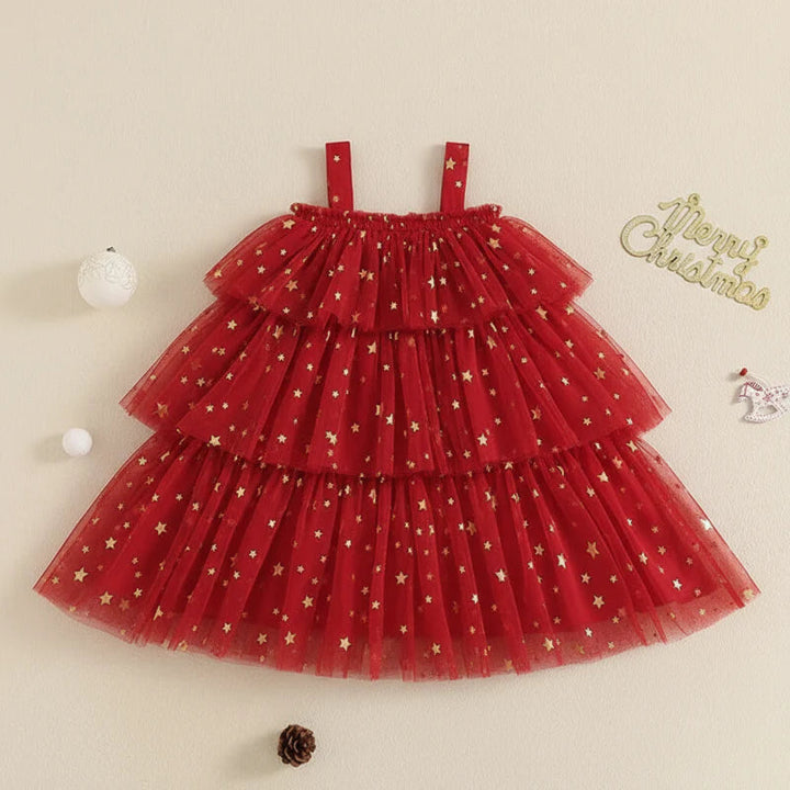 Red Christmas dress with gold star pattern, wide straps, and a tiered skirt