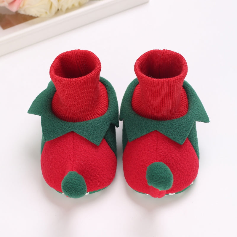 Red and green elf-style baby slippers with ribbed cuffs and green pom-poms
