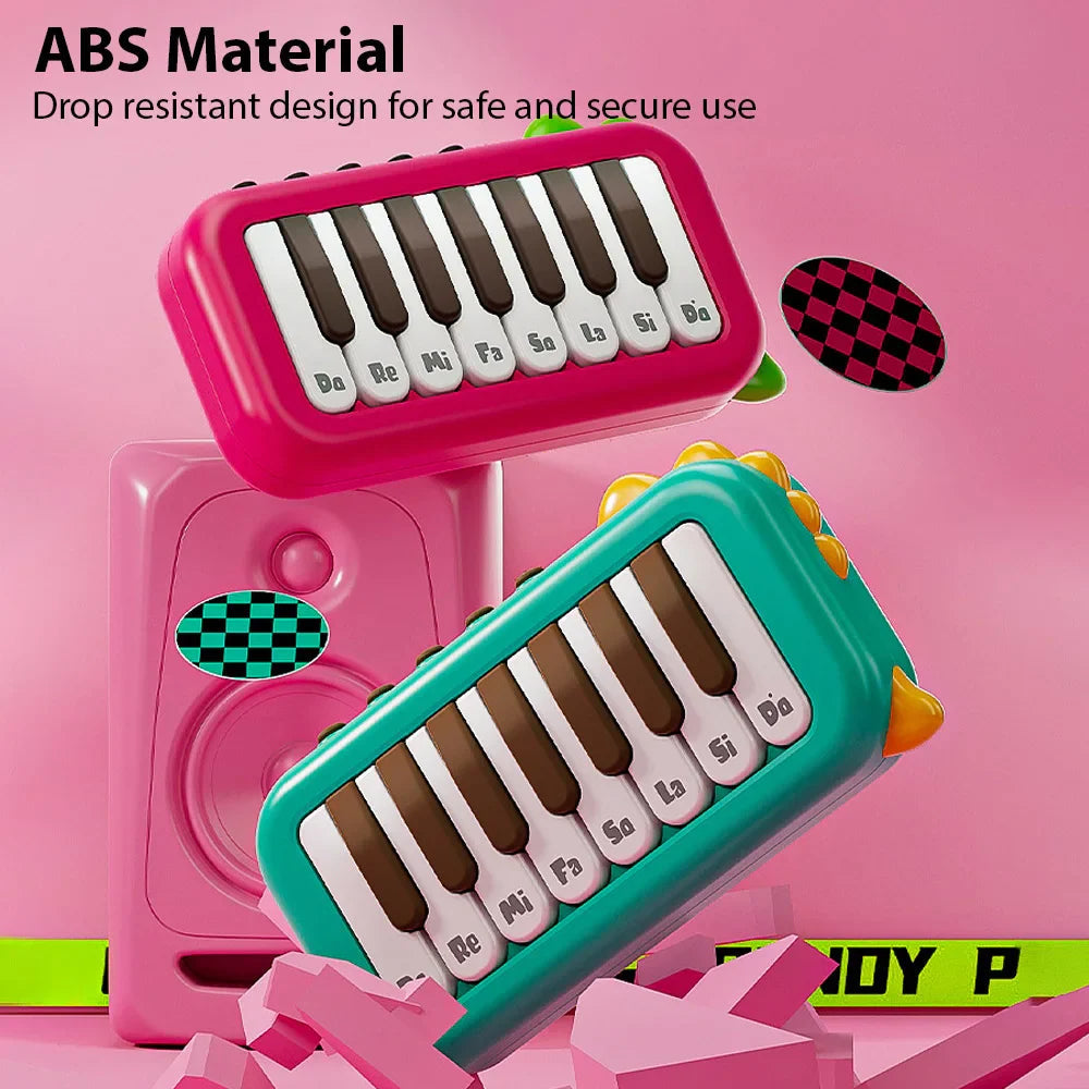 Red and green mini electronic pianos with ABS plastic casings.