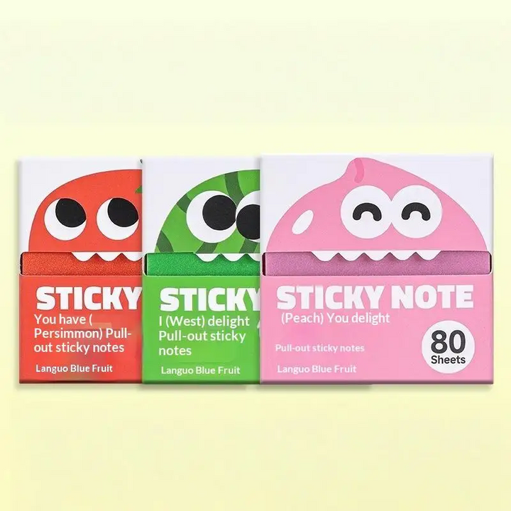 Red, green and pink sticky note packs with cartoon fruit faces
