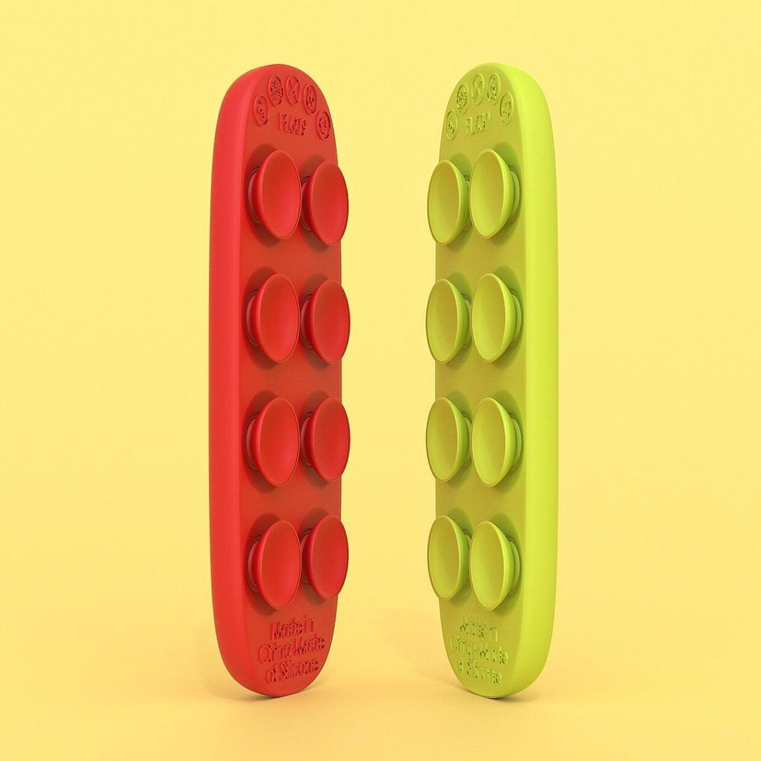 Red and lime-green sensory strips standing upright with round suction cups on their backs.