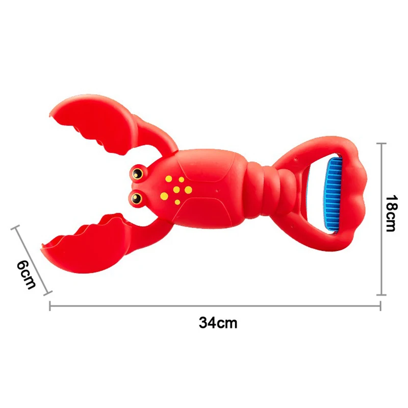 Red lobster-shaped sand grabber measuring 34 x 18 x 6 cm