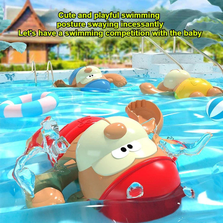 Red monkey bath toy in the foreground with blue and yellow versions floating behind
