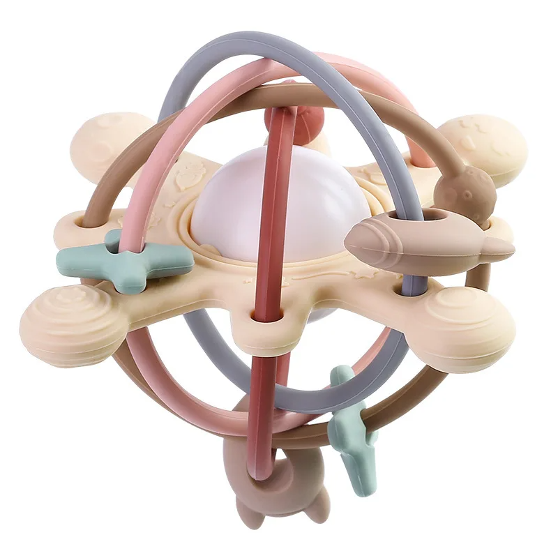 Red silicone teething ball with muted multicolor loops and textured cream-colored ends