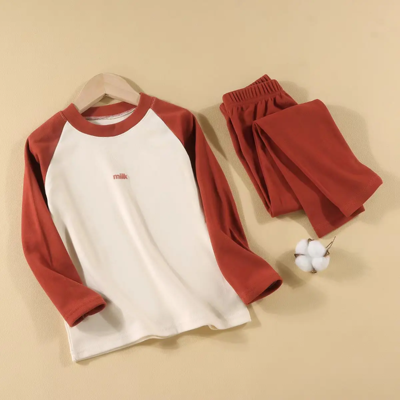 Red pajama set with a cream-front raglan top and matching elastic-waist pants.