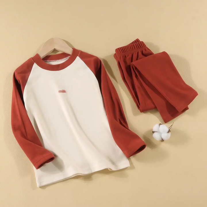 Red pajama set with a cream-front raglan top and matching elastic-waist pants.