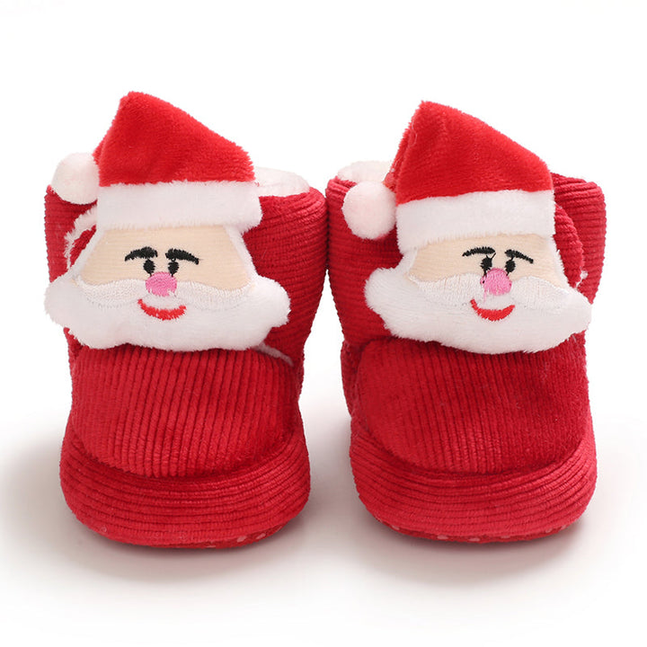Red ribbed baby slippers with Santa faces and white trim