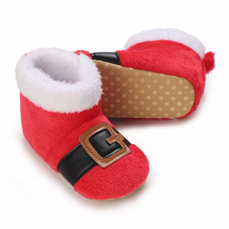 Red Santa-style baby booties with black belts, gold-tone buckles and a dotted sole