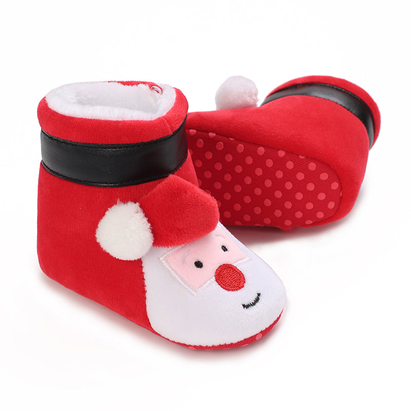 Red Santa-face baby booties with black trim and red dotted soles