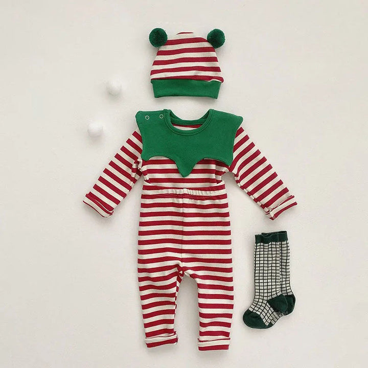 Red-and-white striped baby Christmas outfit with a green collar, pom-pom hat and patterned socks