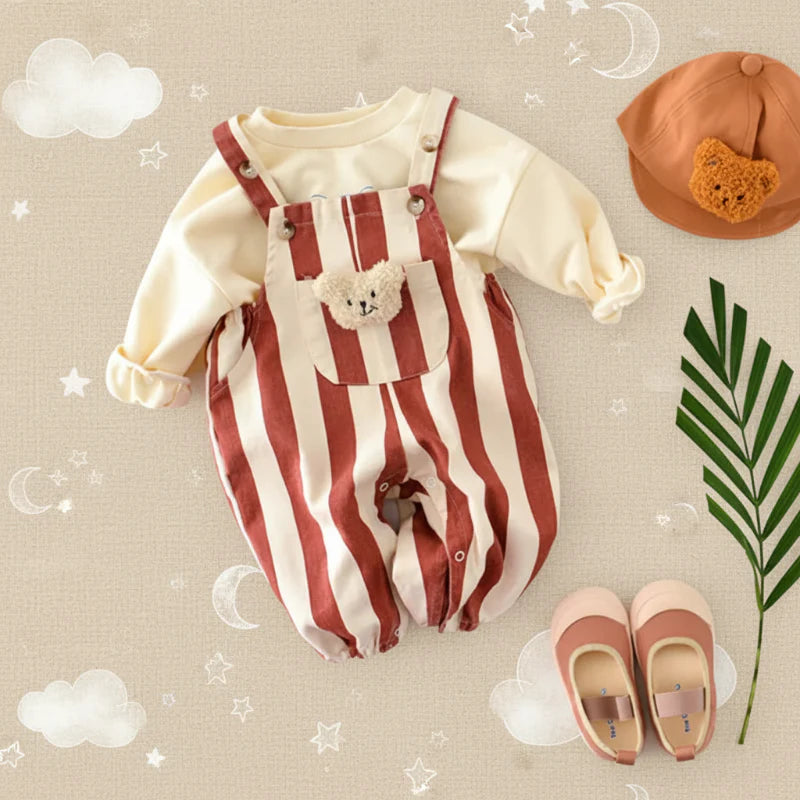 Red striped teddy overall romper styled over a cream long-sleeve top