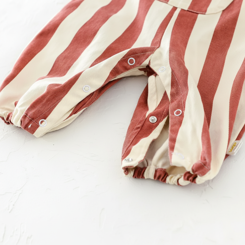 Red striped romper with the snap-button leg openings unfastened