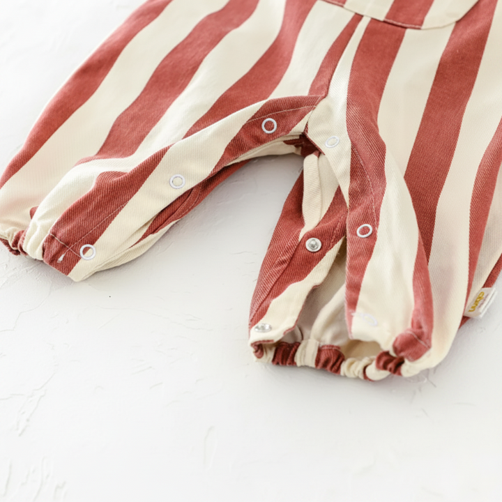 Red striped romper with the snap-button leg openings unfastened