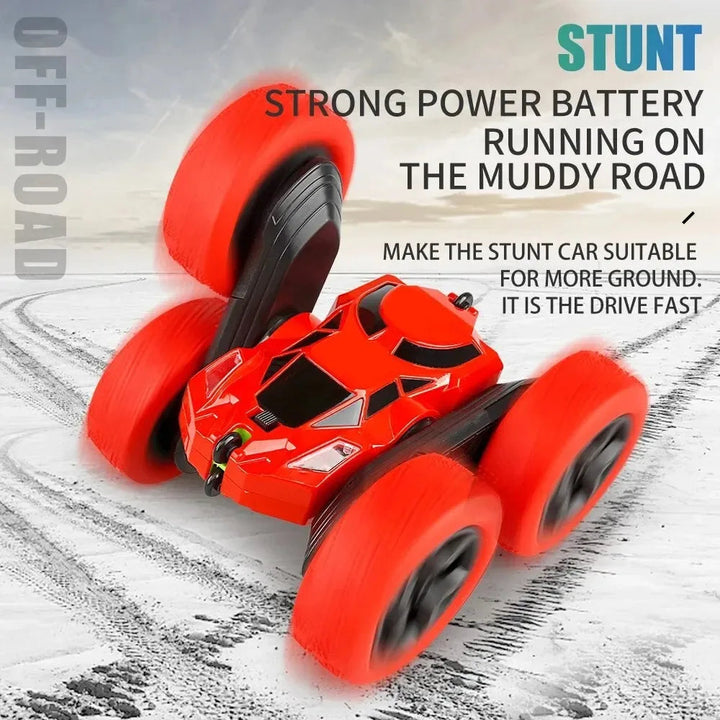 Red RC stunt car with a raised wheel on tire-marked ground