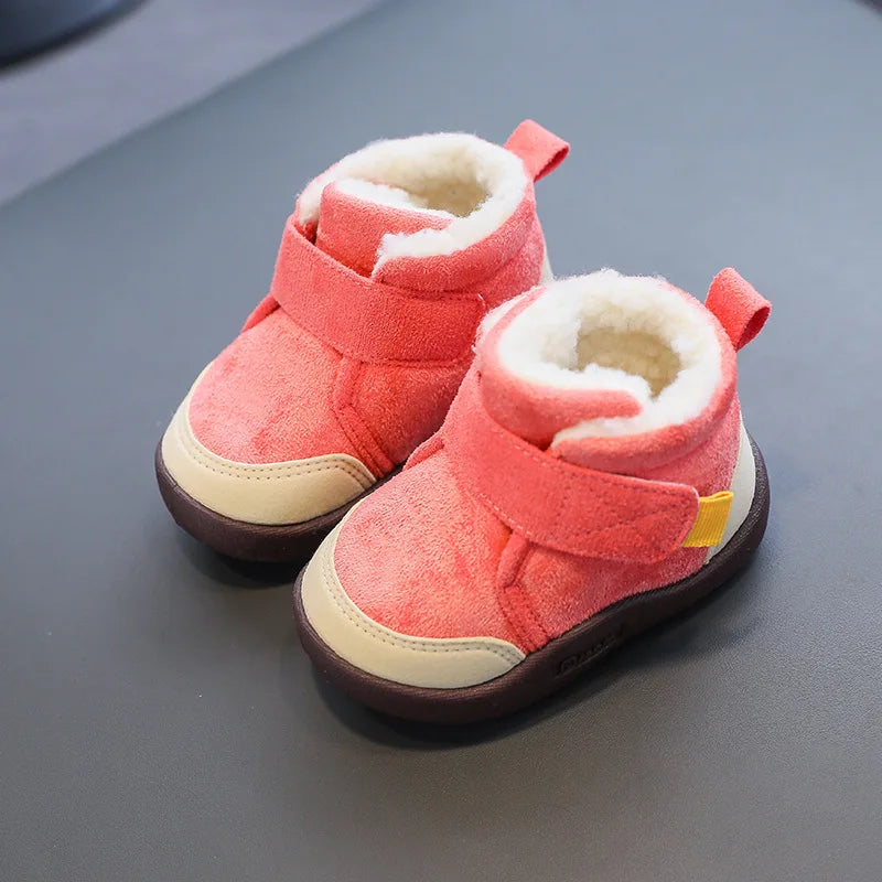 Red suede winter boots with cream plush lining, wide straps, and contrasting beige toe panels