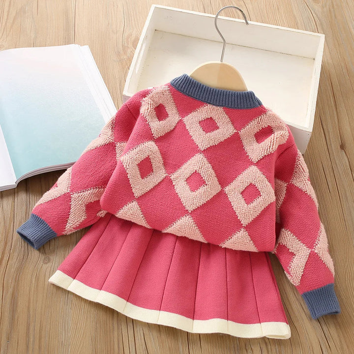 Red sweater and pleated skirt set showing the diamond pattern without floral details