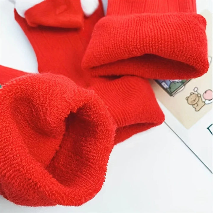 Close-up of the red terry lining and folded cuffs on the Christmas socks