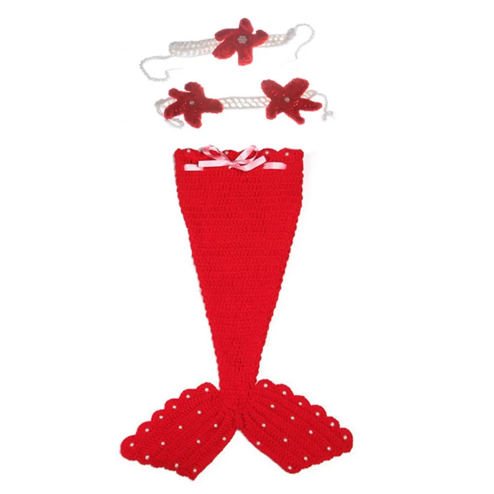 Red three-piece baby mermaid costume with a ribbon-trimmed tail, starfish top, and headband