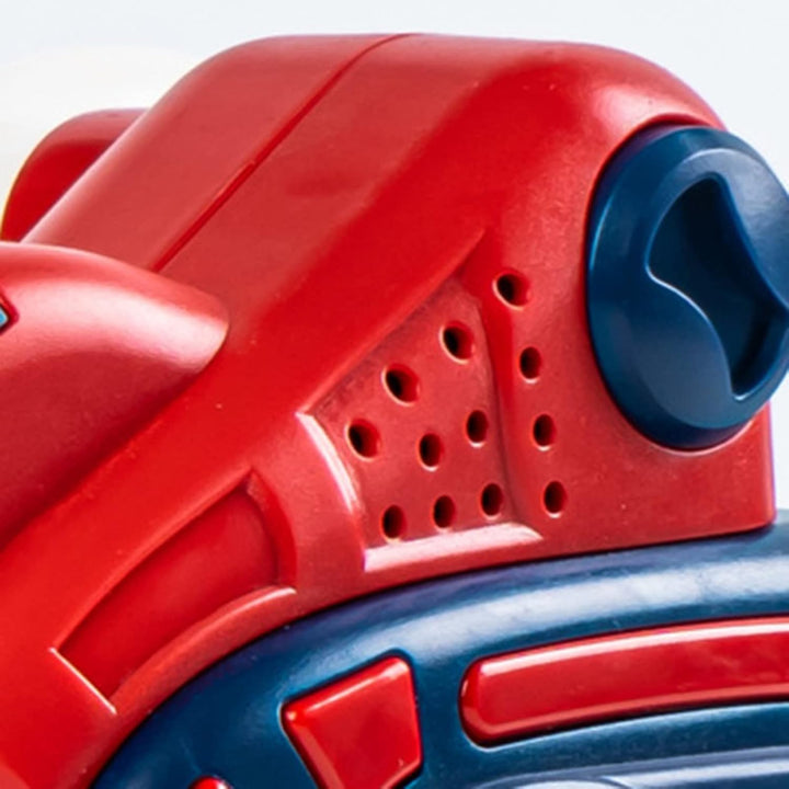 Close-up of a blue control and perforated red plastic housing on the toy saw